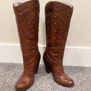 Jessica Simpson cowboy boots in good condition with minor wear and tear